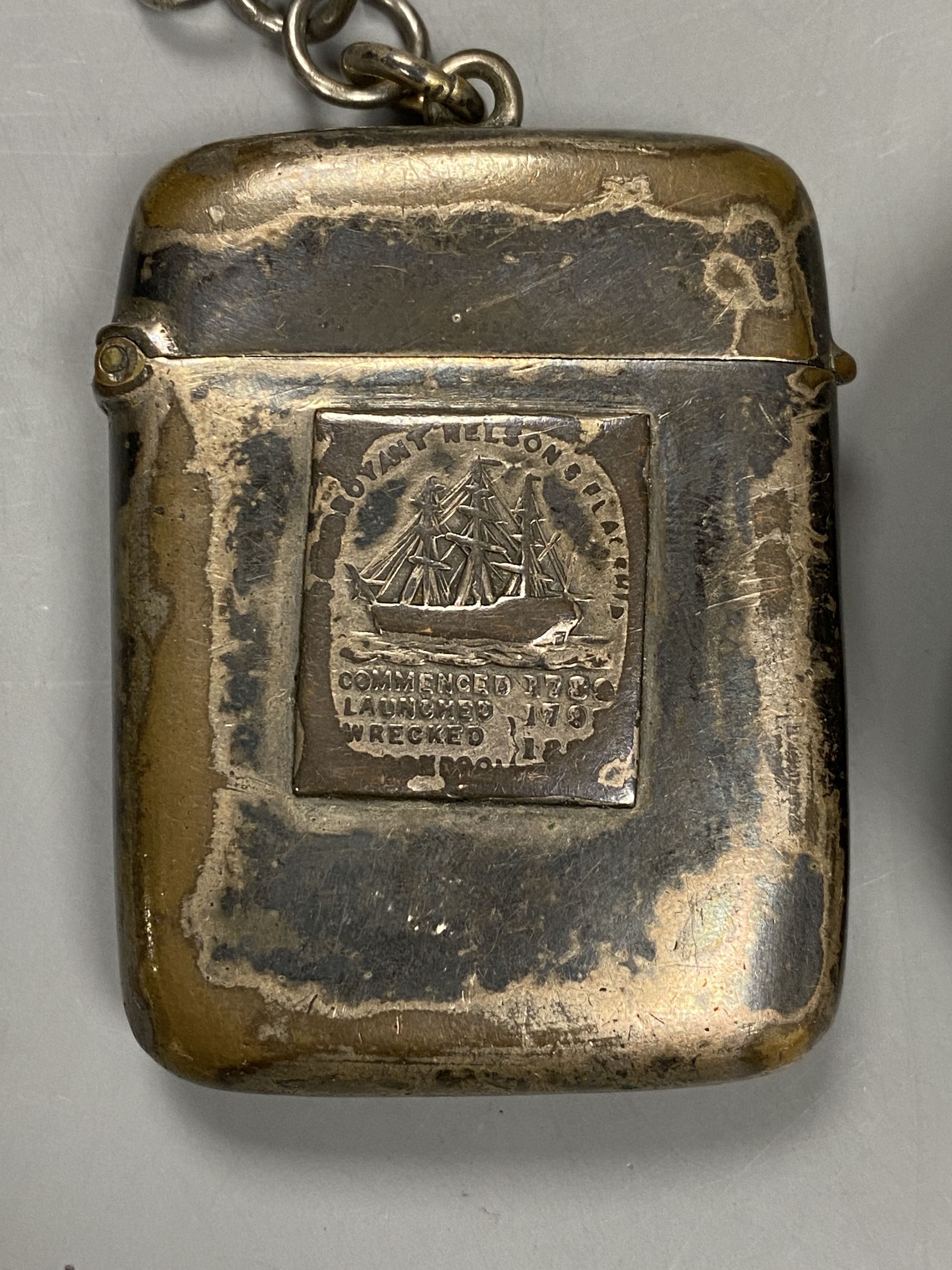 A Victorian oval commemorative snuff box, made from copper from HMS Foudroyant and a similar silver on copper vesta and chain